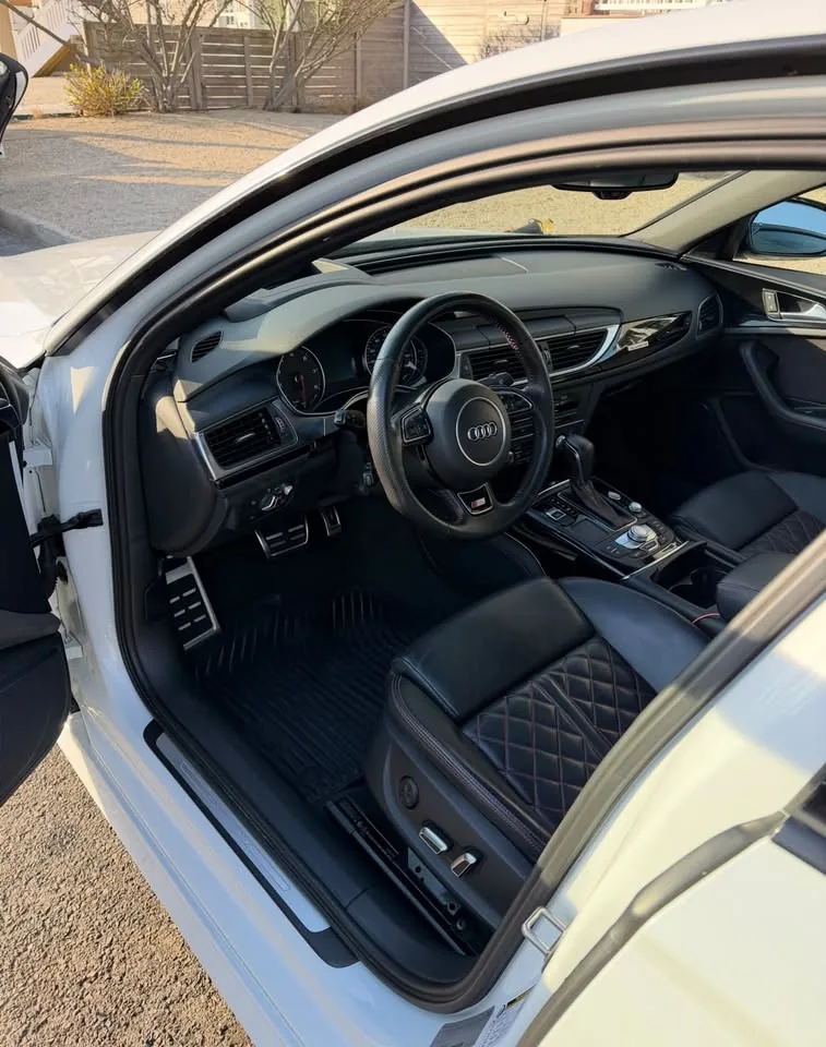 An Audi interior with black quilted leather seats after detailing
