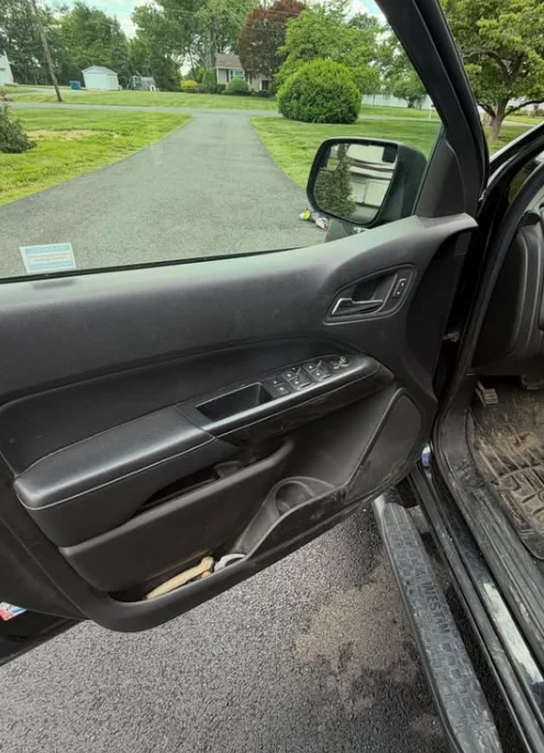 A cleaned interior door card and wing mirror