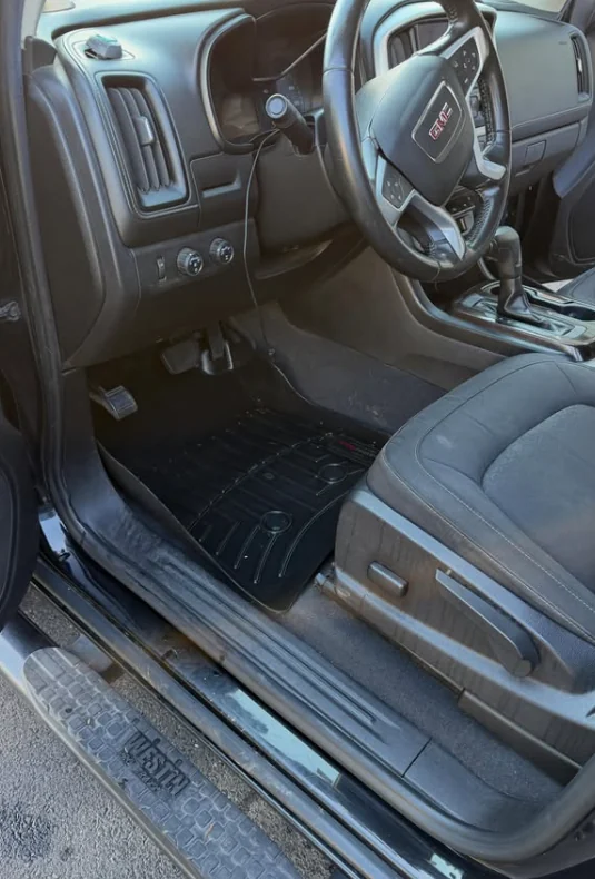 A truck footwell after the mats were removed and cleaned