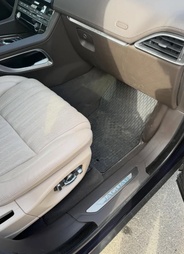 A cleaned cream leather seat and door sill