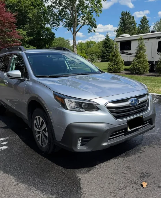 A silver Subaru Outback after an exterior wash