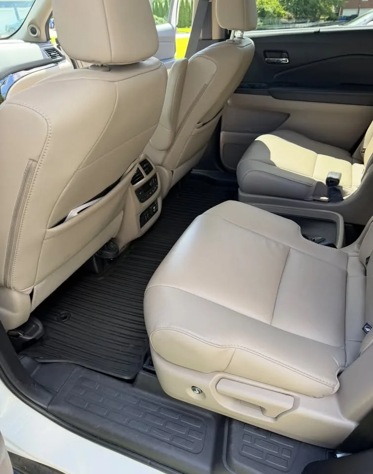 Cleaned tan leather rear seats and floor mats in a Honda Pilot