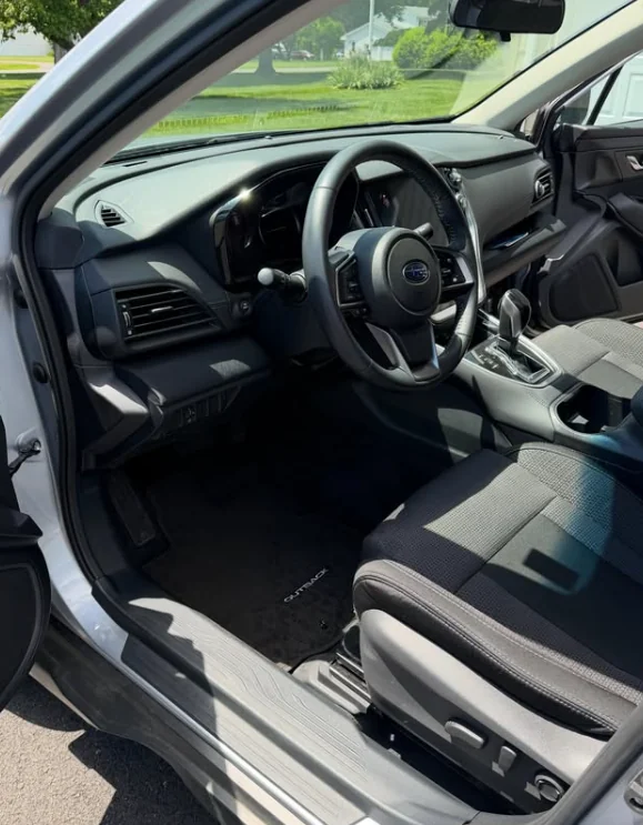 A Subaru dashboard and steering wheel after cleaning