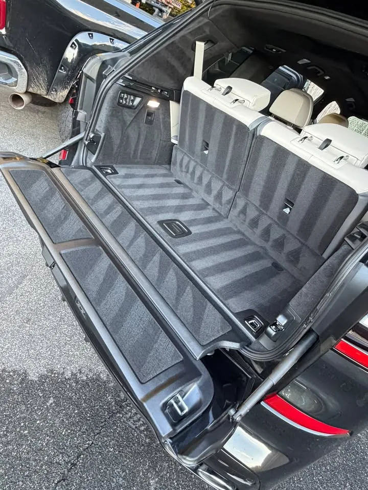 A vacuumed SUV cargo area with the rear seats folded flat