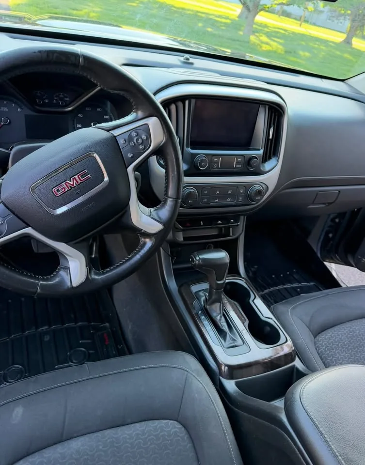 A cleaned truck dashboard, steering wheel and centre console
