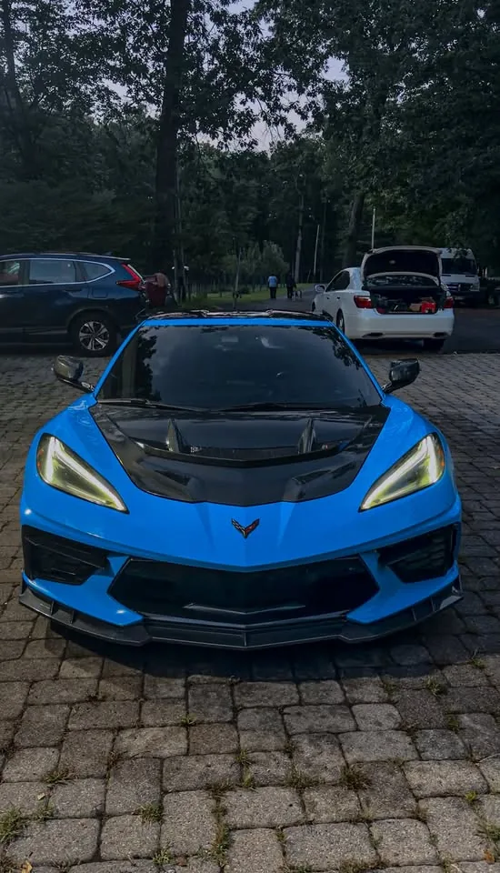 A blue C8 Corvette photographed after a full detail